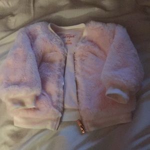 Stylish pink baby jacket with gold zipper